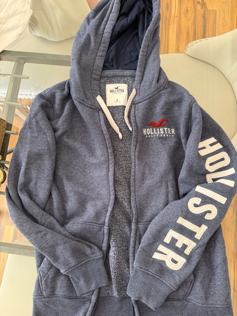 Hollister Y2K Navy Blue Zip-Up Hoodie with White Lettering and Red Seagull